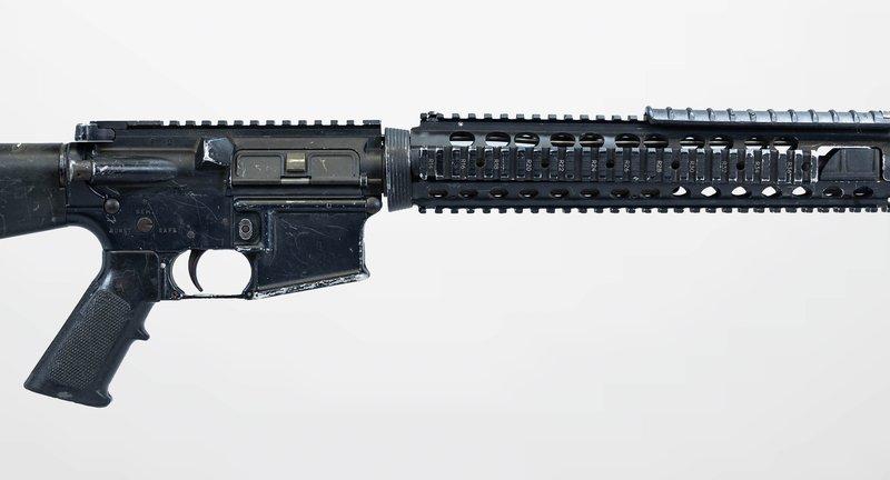 Side view of an M16A4 with an A2 stock and quad rail