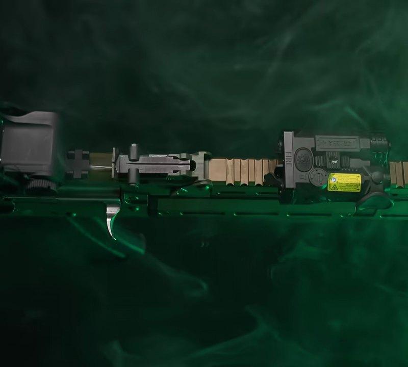 Muzzle end of the PSA Sabre 5.56 AK showing the Plan B compatible muzzle device, railed gas tube and M-LOK handguard